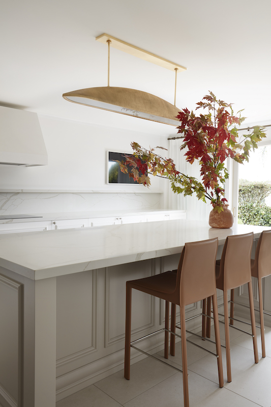 Contemporary dining room with long table and chairs - Marylou Sobel Interior Design.