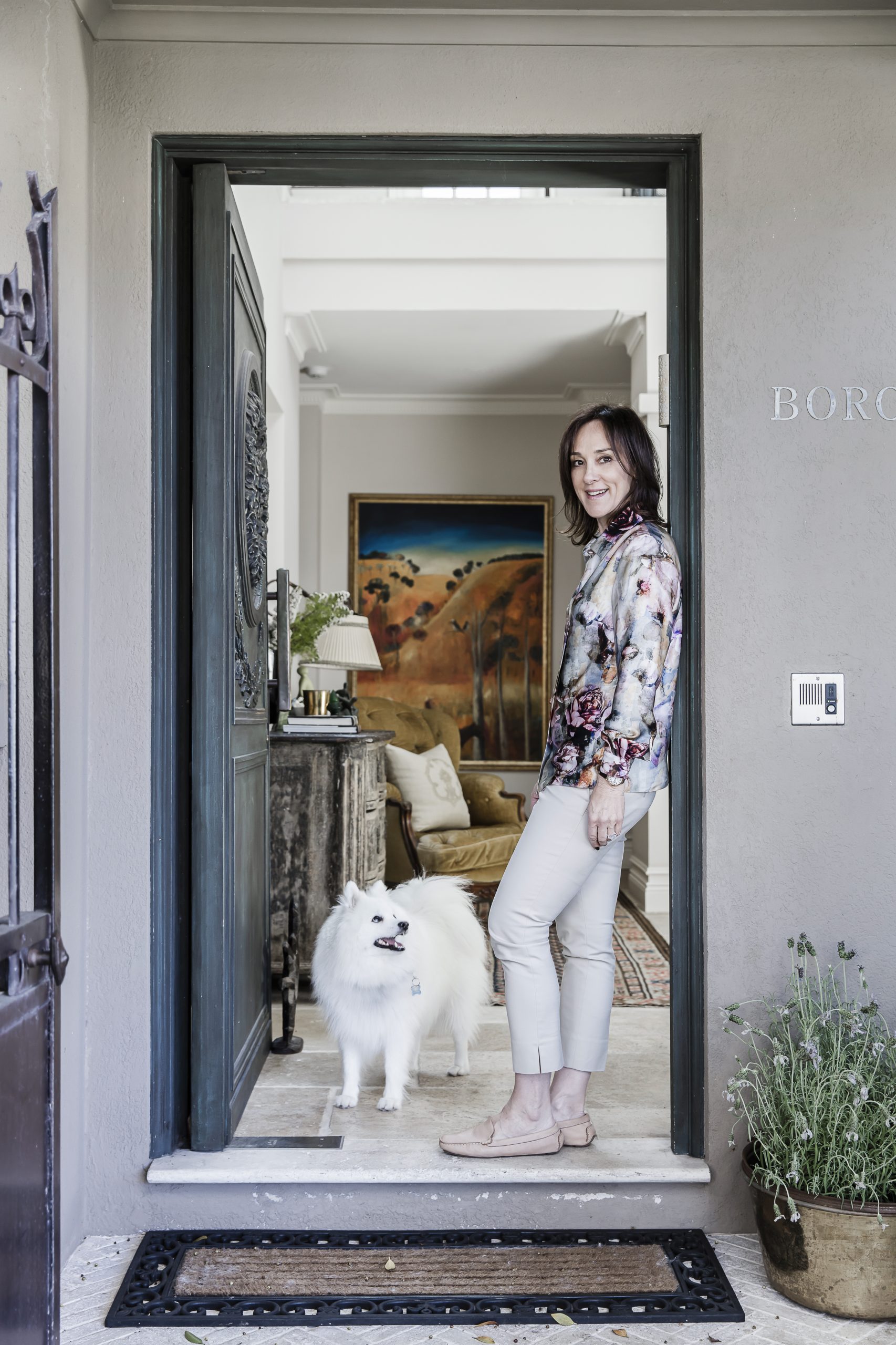 Marylou Sobel in the doorway of her home